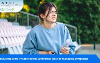 A woman holding stomach due to Irritable Bowel Syndrome (IBS) discomfort
